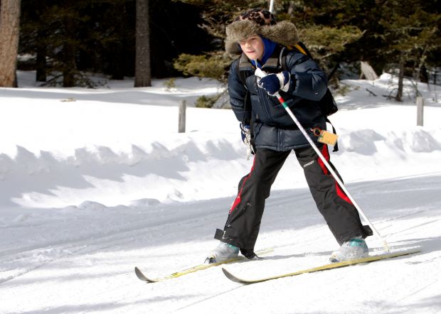 Nik Wilmer skis down a hill